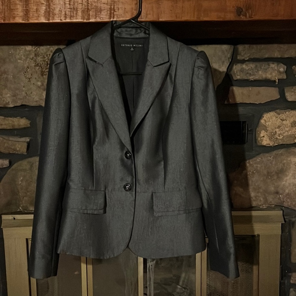 Excellent condition. Beautiful dark gray jacket. Only worn once.